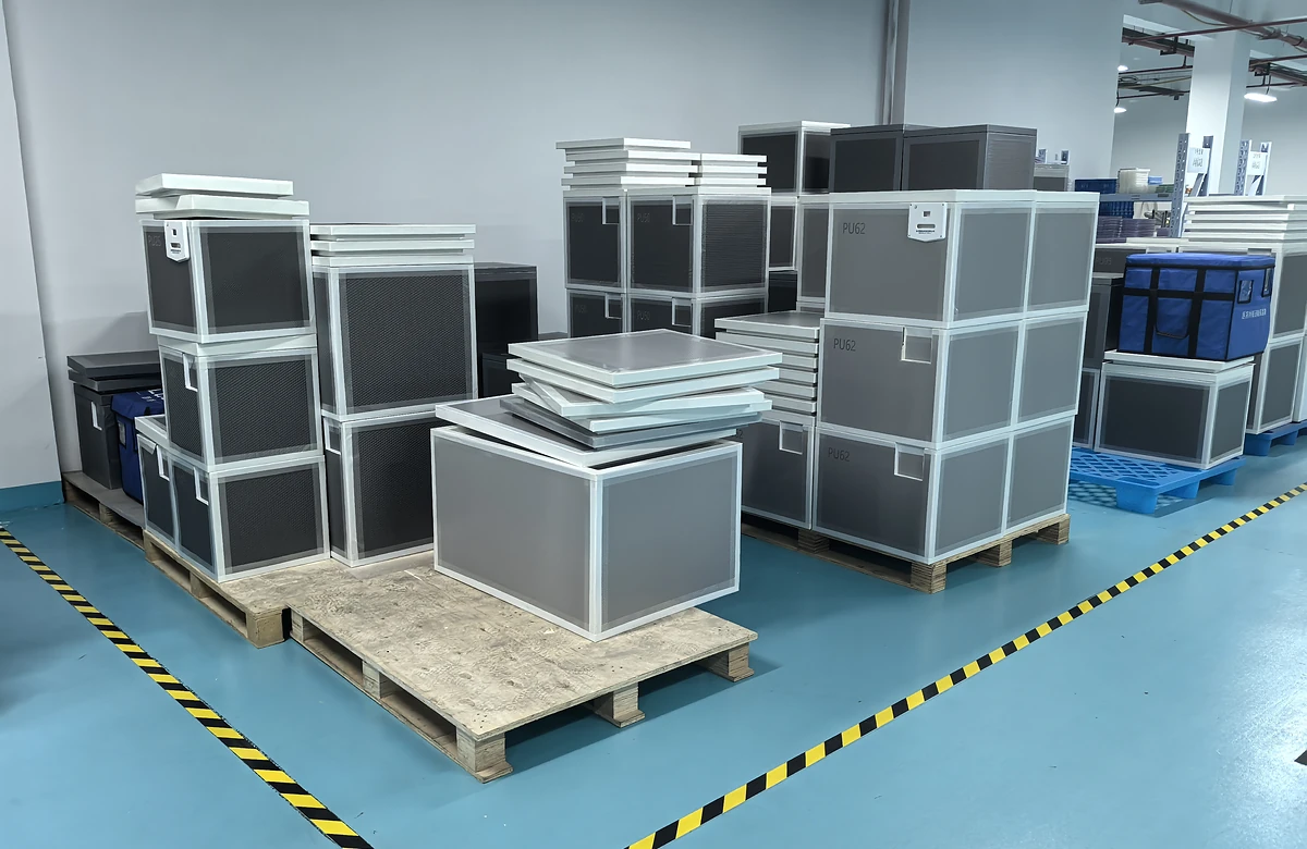 Insulated boxes in a workshop, from the customer materials